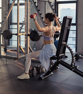 WHAT ARE THE TOP HOME EXERCISES-now it's easy to stay in shape - photo of girl in weight machine